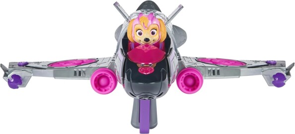 Chienne Stella de la Pat' Patrouille installée comme pilote de l'avion de chasse dans le cockpit avec vue sur le lance-projectiles