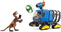 Véhicule Schleich face au Dakotaraptor avec filet vert en projection